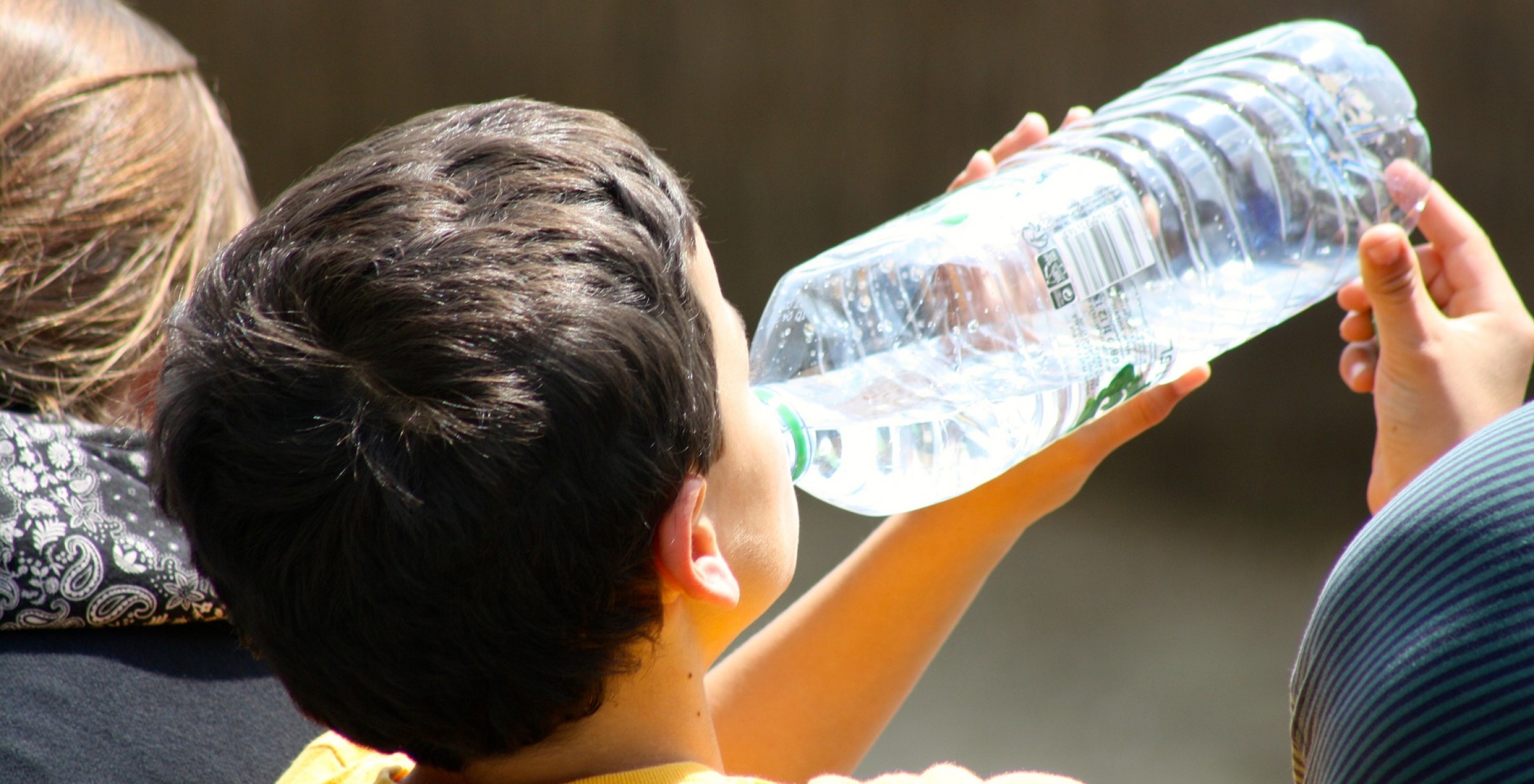 boy drinking from bottle