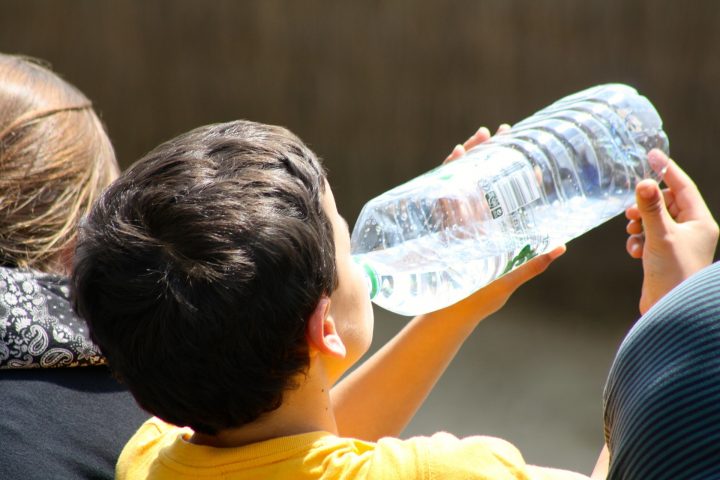 boy drinking from bottle